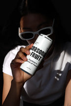 Slim Can Mockup CF03 – Held to Face, Window Light