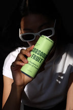 Slim Can Mockup CF03 – Held to Face, Window Light