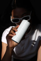 Slim Can Mockup CF03 – Held to Face, Window Light