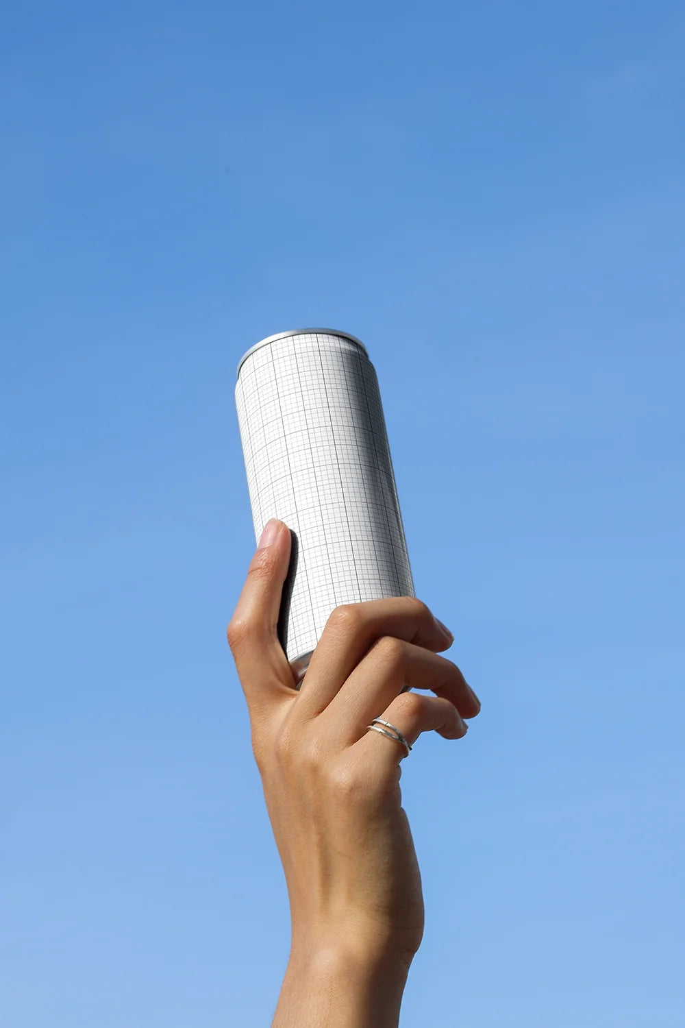 Slim Can Mockup CF32 – Held Upward, Blue Sky