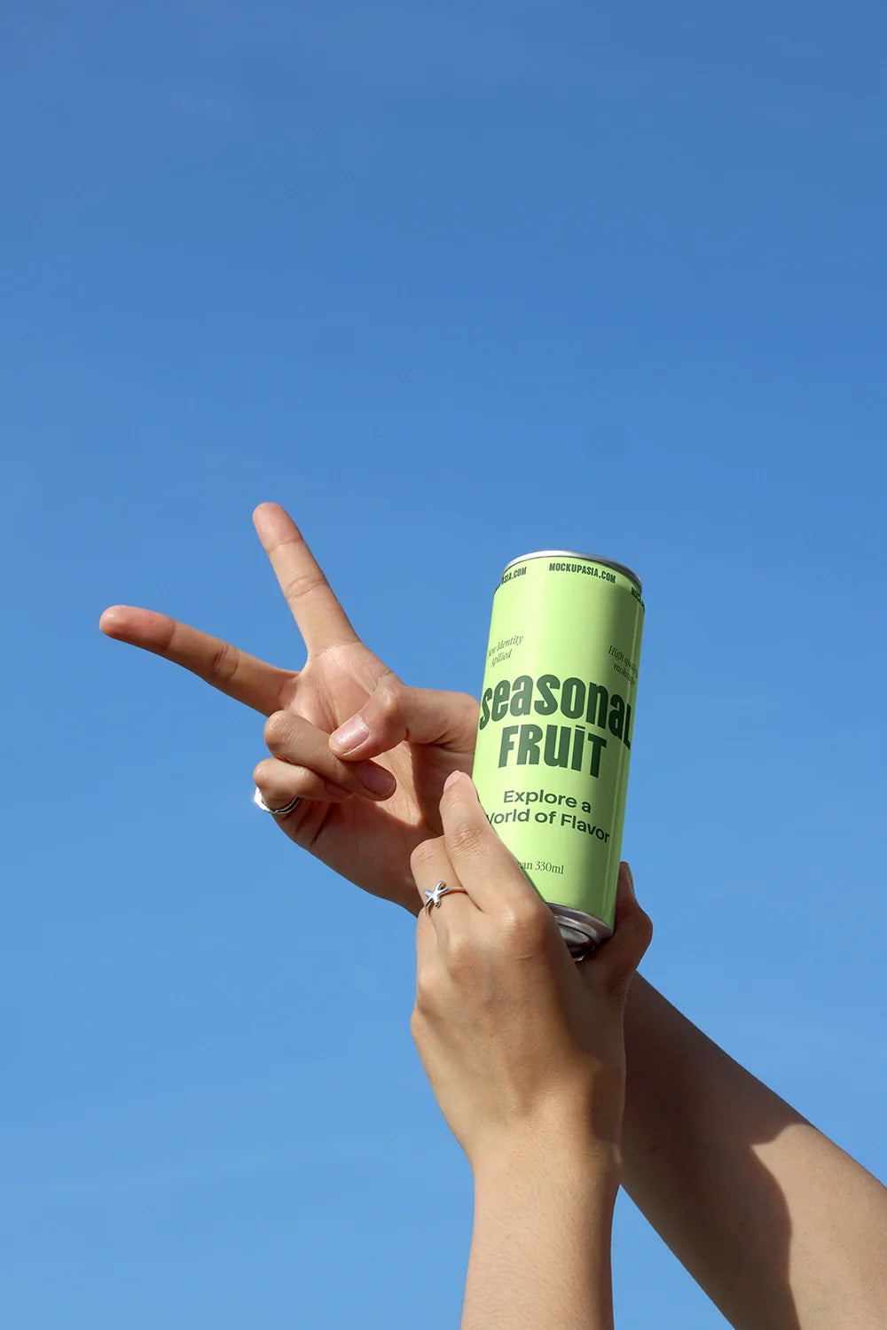 Slim Can Mockup CF10 – Held Against Blue Sky
