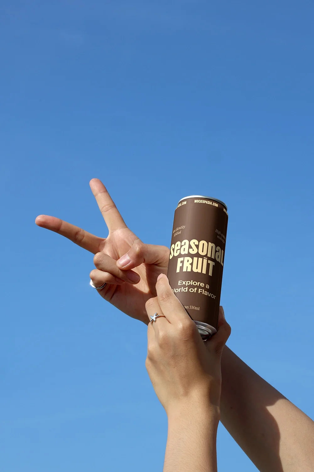 Slim Can Mockup CF10 – Held Against Blue Sky
