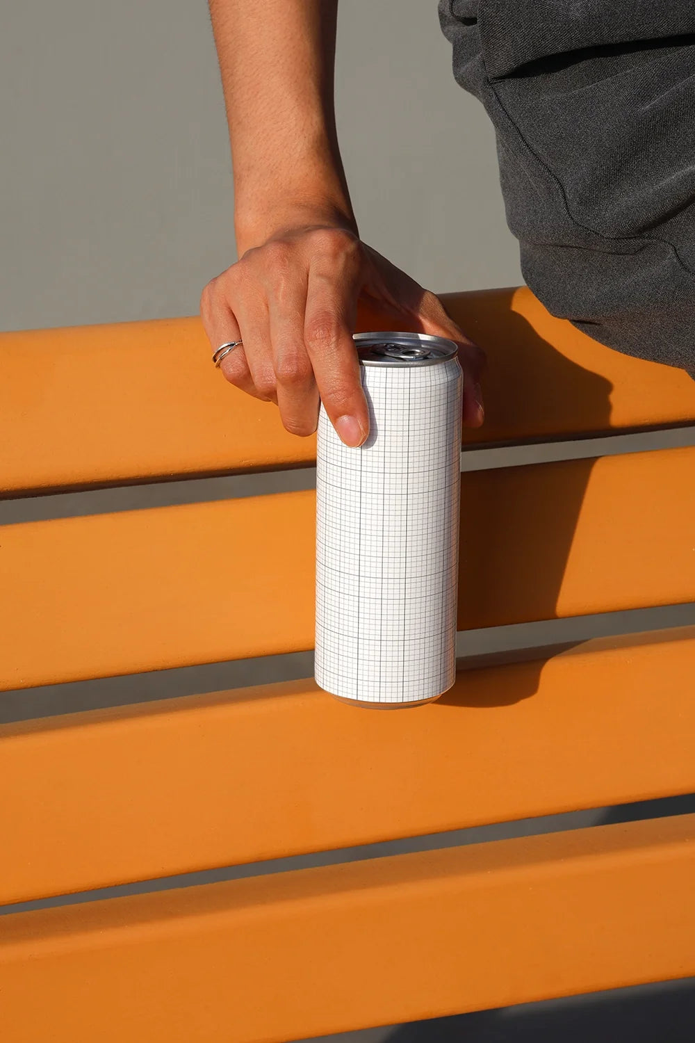 Slim Can Mockup CF25 – On Orange Bench
