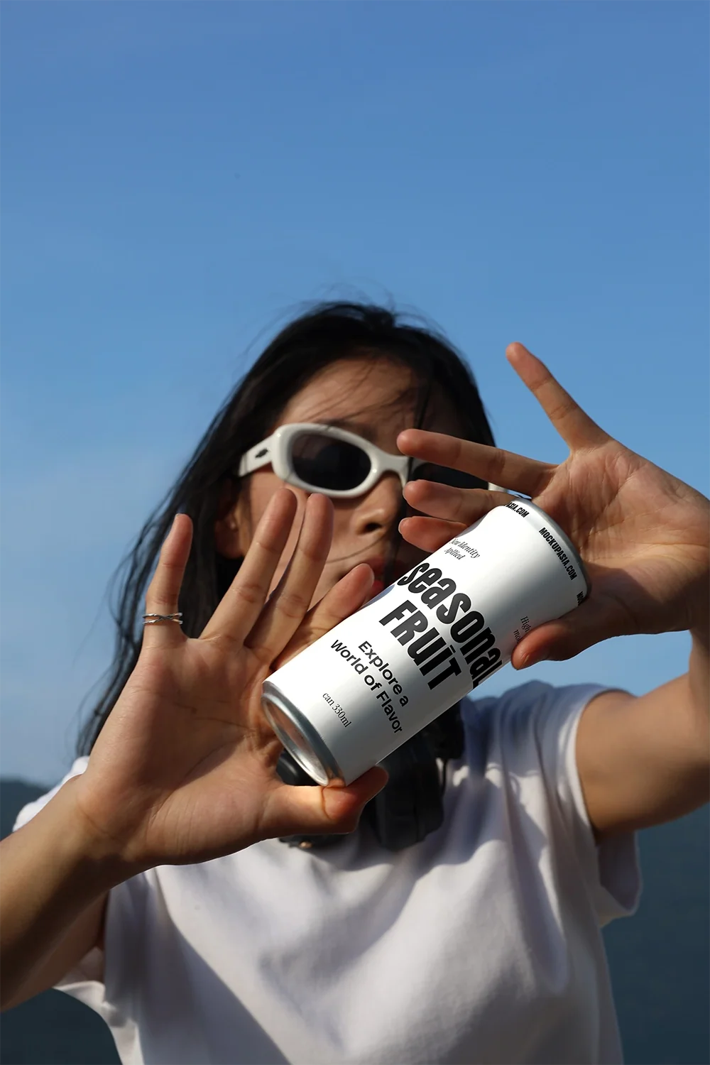 Slim Can Mockup CF28 – In Hand, Bright Sky