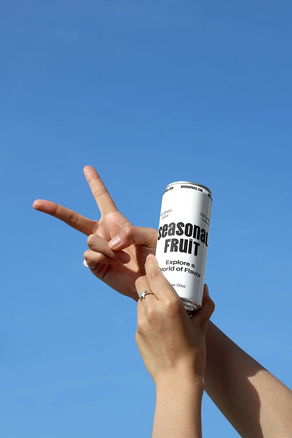 Slim Can Mockup CF10 – Held Against Blue Sky